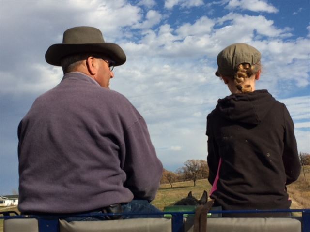 Denis and grand-daughter driving team on roundup